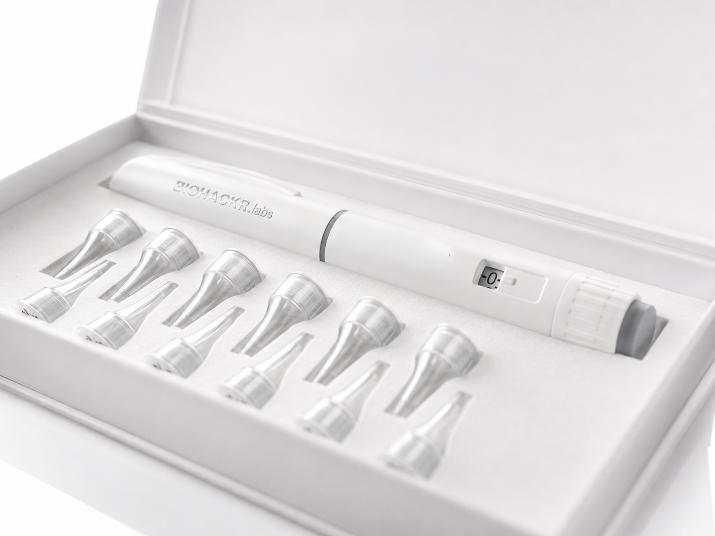 Premium hard case open at angle — pen and needle kit in foam insert